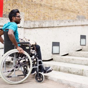 wheelchair man struggling with steps